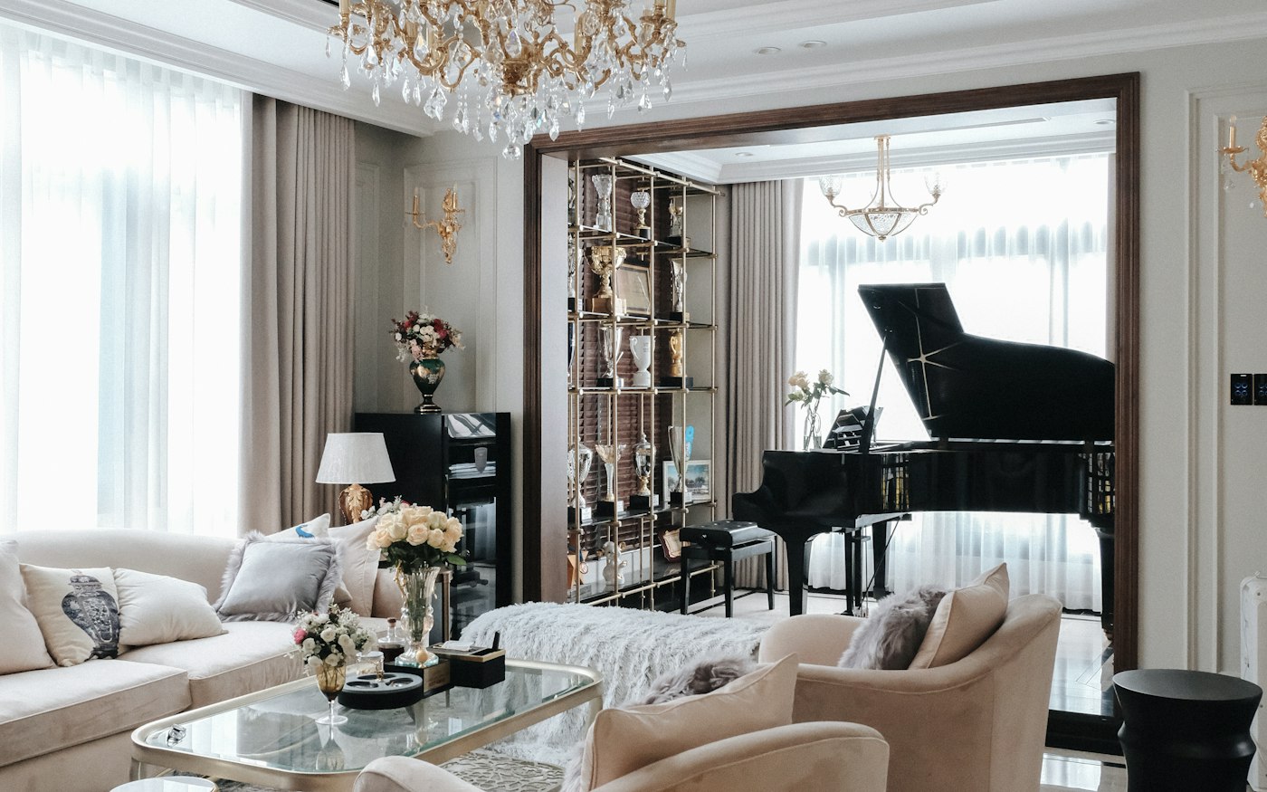 A double-height salon with a crystal chandelier