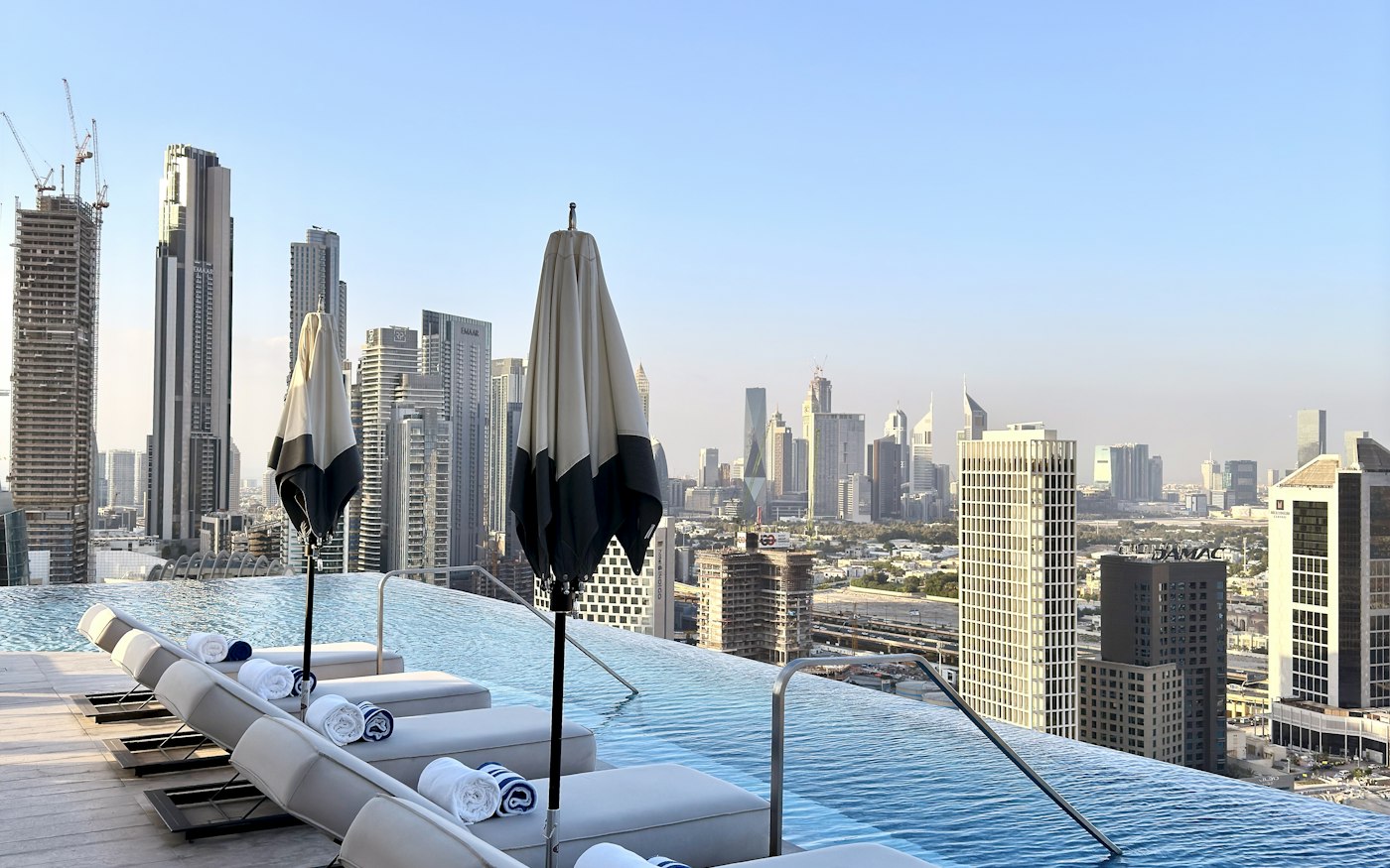 A rooftop infinity pool over the Dubai skyline